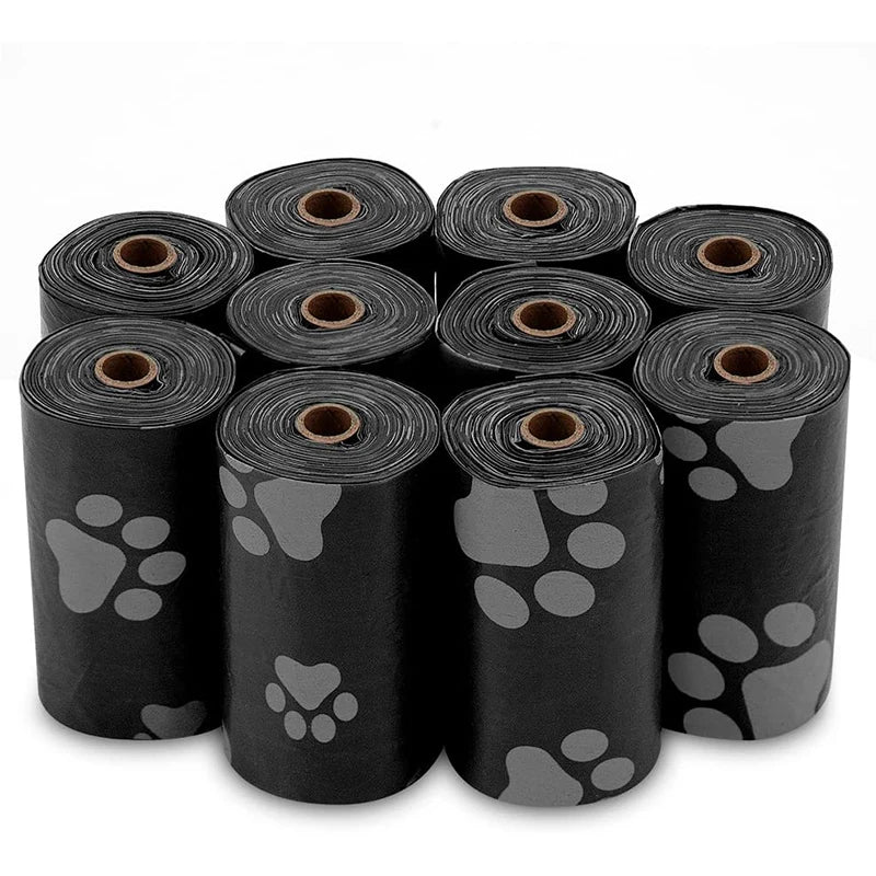 Multiple rolls of black pet waste bags with paw print design on a white background