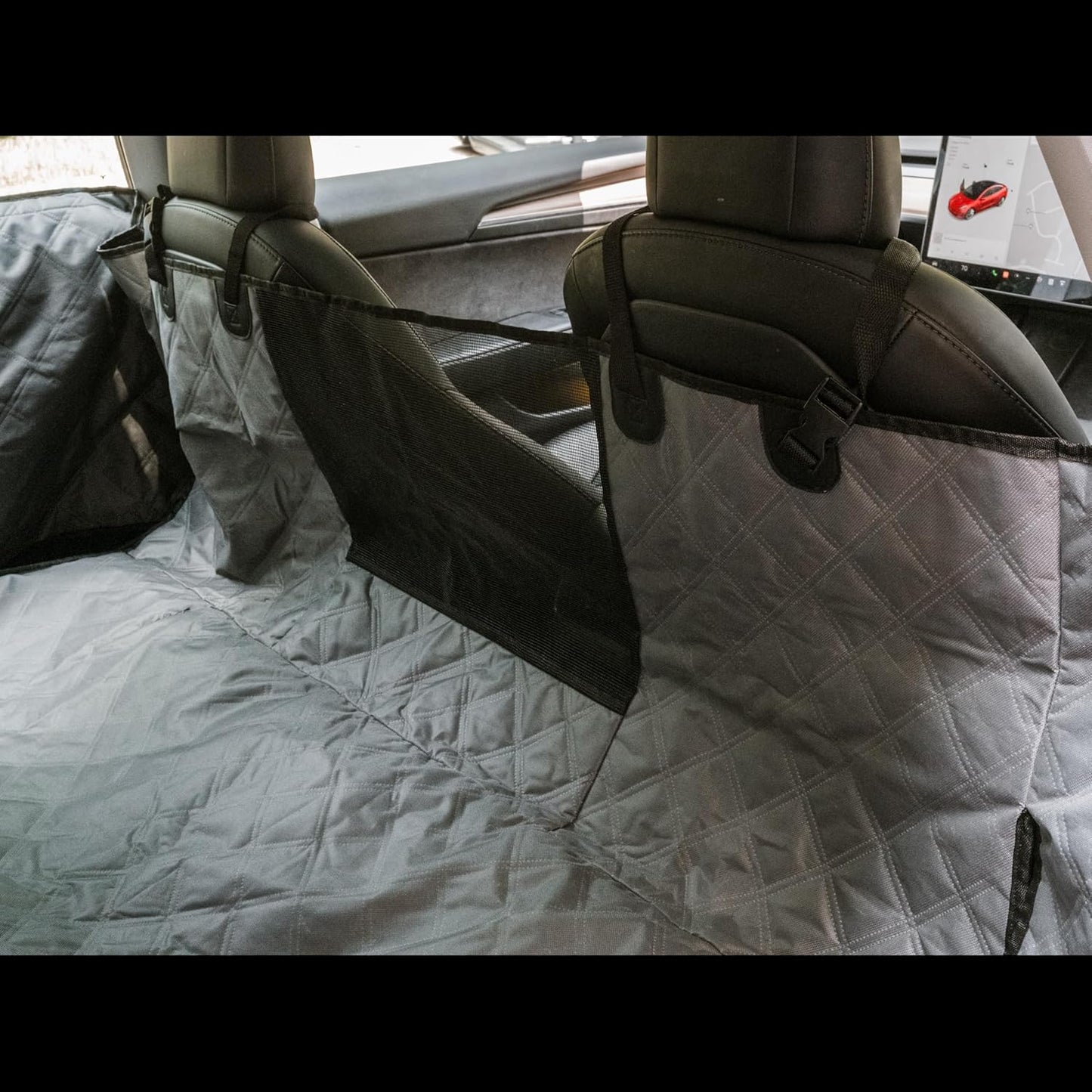 Car seat cover on a car seat with a quilted pattern, inside a vehicle.