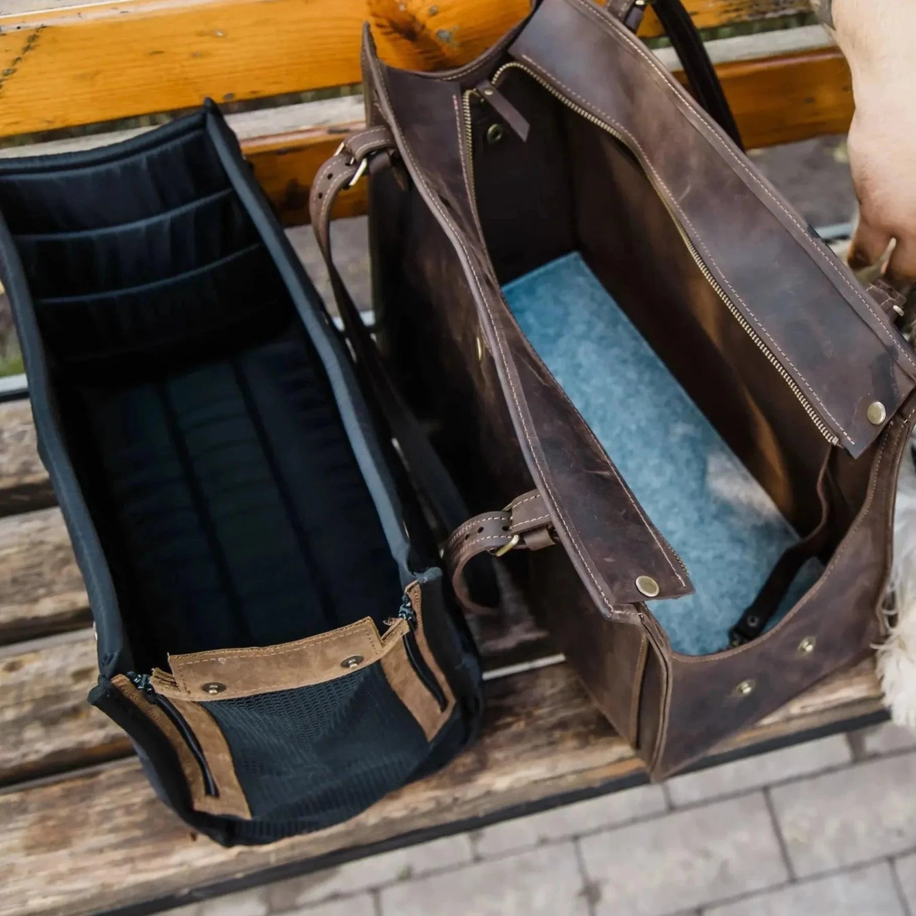 Black leather dog carrier side view - secure zipper closure and front storage pocket
